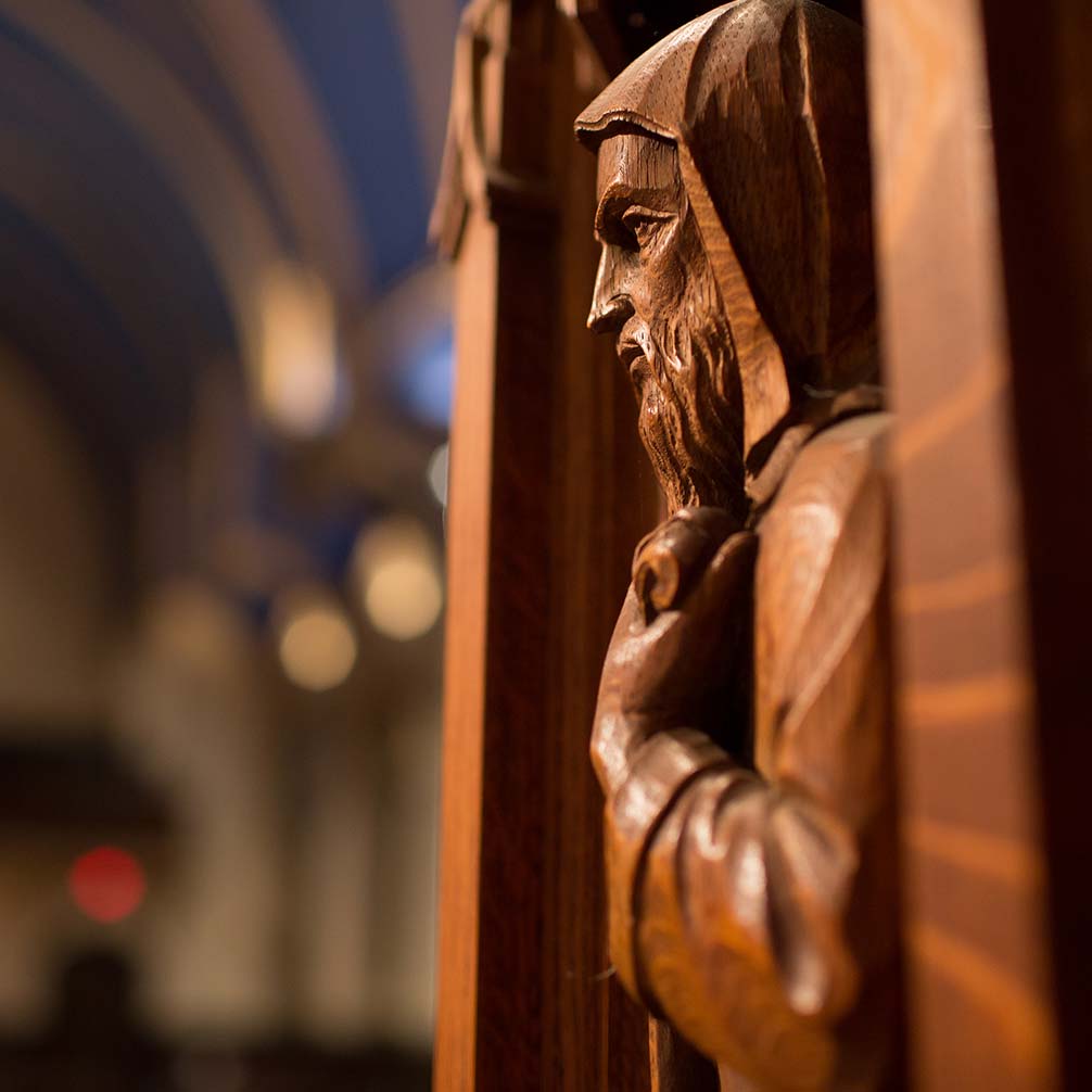a wooden carving on the pulpit of Brown Memorial Church