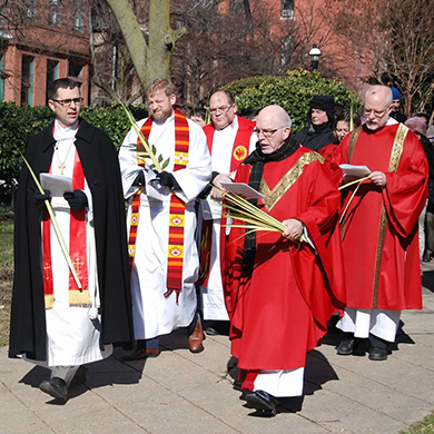 The faith leaders of the churches in Bolton Hill walk together during the neighborhood Palm Procession.