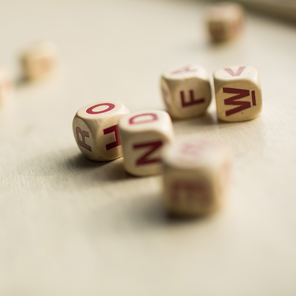 Upclose photo of letter dice.