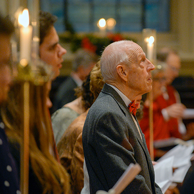 A member of Brown Memorial has his eyes raised upward during a Christmas Eve service.