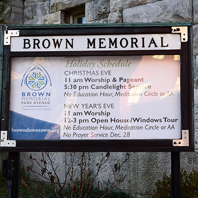 Brown's outdoor sign showing the holiday week schedule.