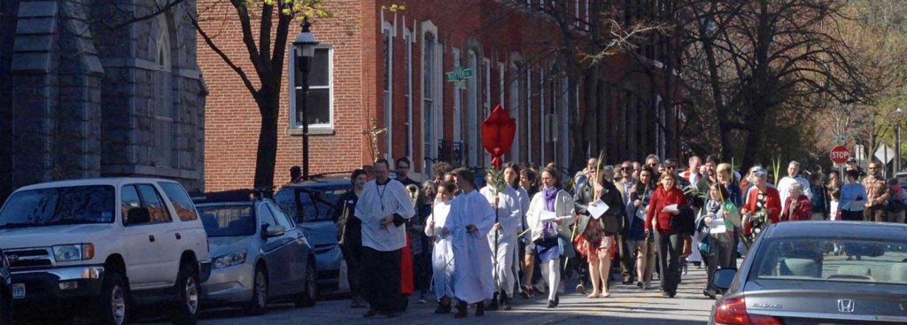Members of Brown Memorial, Memorial Episcopal and Corpus Christi walk in the Palm Procession through Bolton Hill on Palm Sunday 2017.