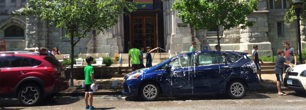 Brown Memorial youth wash cars in front of the church.