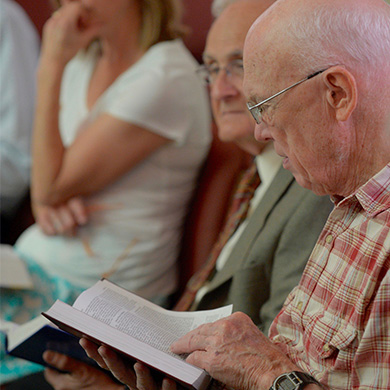 A church member looks at the Bible during the Adult Education Hour.