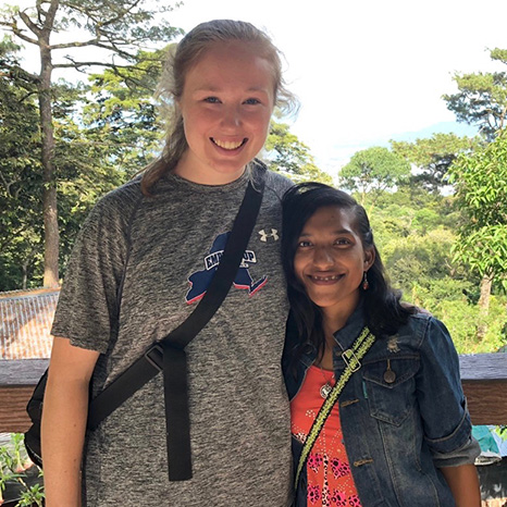 A youth group member with an El Salvadoran friend.