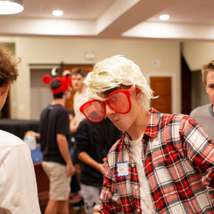 A youth group member plays a game during Sunday Night Live.